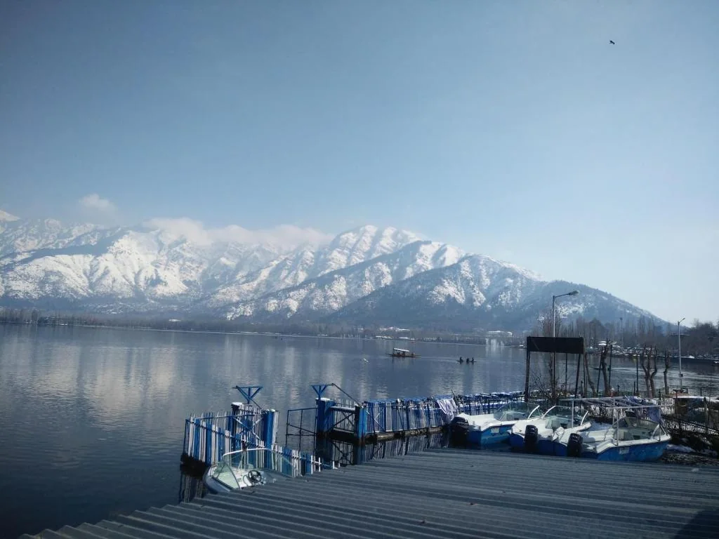 Snow-covered Pir Panjal range across Dal Lake